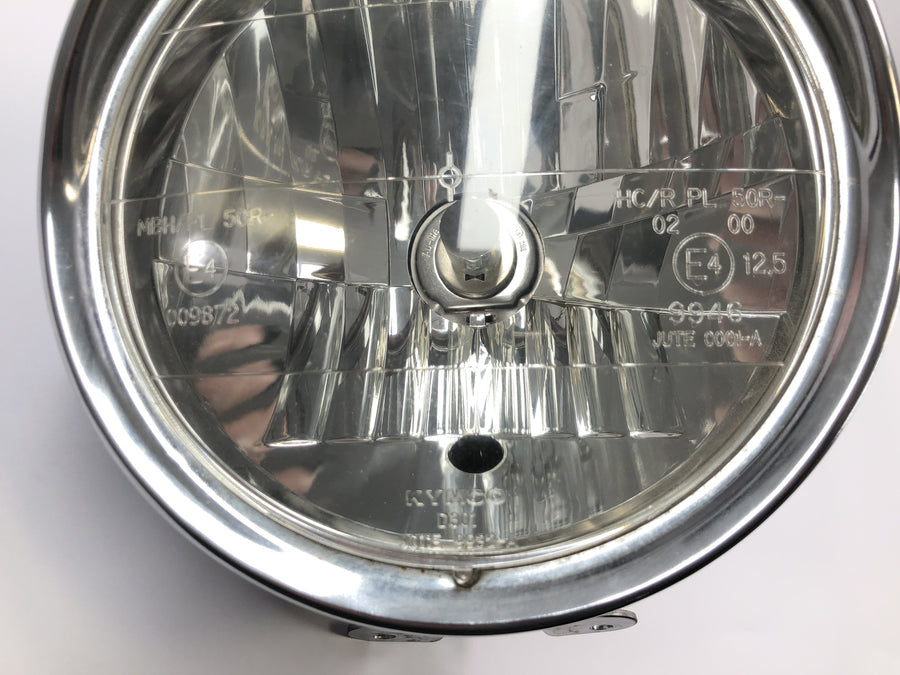 Yamaha XVS 650 4VR [1997] - Přední světlomet s chromovaným pouzdrem žárovky